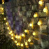 Saulės energija įkraunama šventinė lauko girlianda su rutuliukais, 50 LED, 7,5 m