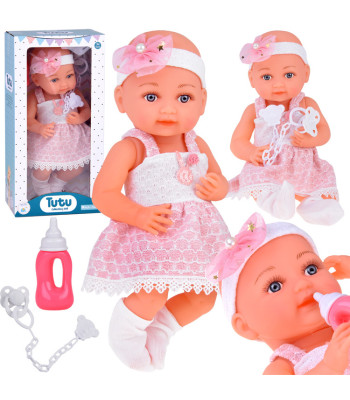 Guminė lėlė kūdikis rožine suknele, buteliukas ir čiulptukas ZA5235