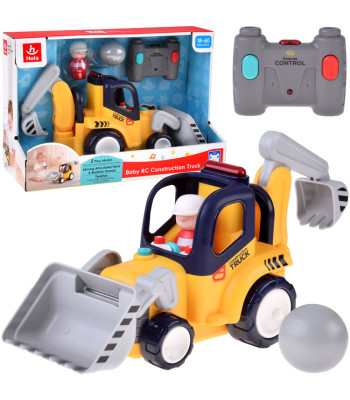 Nuotoliniu būdu valdomas statybinis automobilis - buldozeris-kasikas